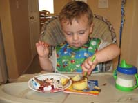 34-trying_to_use_a_fork_for_his_dessert