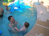 16-Daddy_catches_Kenny_as_he_jumps_into_the_pool