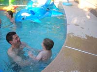 17-Daddy_catches_Kenny_as_he_jumps_into_the_pool
