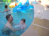 18-Daddy_catches_Kenny_as_he_jumps_into_the_pool