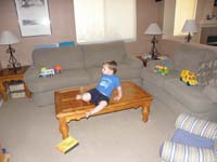 17-Kenny_watching_TV_from_the_table