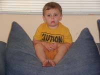 55-Kenny_wears_a_pathetic_face_while_Mommy_vacuums