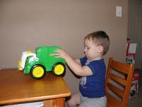 08-Daddy_and_Kenny_play_with_the_garbage_truck