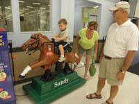 24-Grammy_and_Grandpa_Duke_watch_Kenny_ride_the_pony