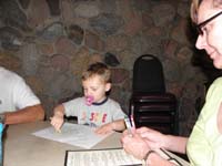31-grumpy_Kenny_gets_to_suck_on_a_purple_pacifier_while_coloring