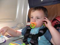 45-on_the_plane_home-he's_tired_but_just_won't_sleep