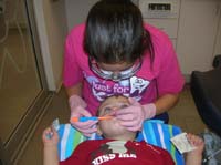 49-getting_his_teeth_brushed