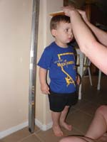 62-measuring_Kenny's_height