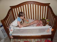 01-Kenny_told_Mommy_to_get_in_his_bed-now_he's_giving_her_a_pacifier