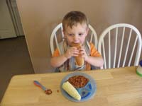 18-Kenny_eating_his_hot_dog_like_a_big_boy
