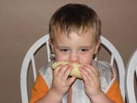 20-Kenny_eating_his_corn_on_the_cob_like_a_big_boy