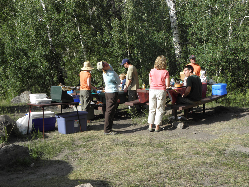 75-adults_around_the_picnic_tables