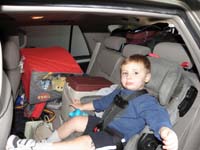 02-Kenny_shares_the_backseat_with_some_gear