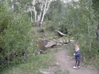15-Kenny_thinks_it's_cool_we_have_a_creek_next_to_our_campsite