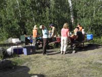 75-adults_around_the_picnic_tables