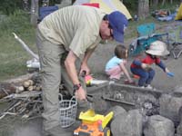 79-Josh_and_the_kids_clean_out_the_firepit