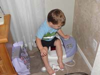 04-Kenny_pretends_Mommy's_foot_bath_is_a_truck_he_can_drive