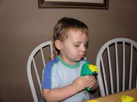 07-Kenny_squeezes_Play-Doh_by_himself