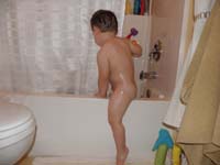 13-Kenny's_climbs_back_into_the_bathtub-he's_got_good_muscle_tone