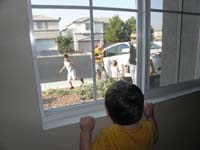 65-Kenny's_looks_out_the_window_excited_the_Brewsters_arrived