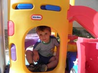 67-Kenny_hangs_out_in_the_fort_under_his_slide