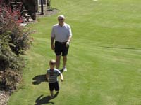 07-Kenny_and_Duke_run_around_the_house