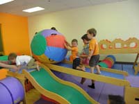 55-Kenny_waiting_for_his_turn_to_push_the_ball_up_the_ramp