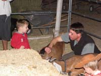 04-Daddy_and_Kenny_pet_the_goat