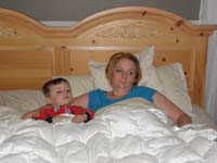 11-sicky_Kenny_and_Mommy_watch_TV_in_bed