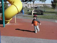 06-Kenny_having_fun_at_the_park-kept_the_helmet_on_because_he_occasionally_rode_the_scooter