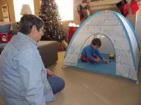 03-Kenny's_excited_about_his_new_tent_and_trucks_and_cars