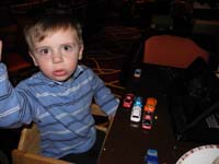 24-Kenny_playing_with_cars_and_watching_Monsters_Inc_at_the_M_buffet