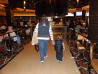 26-Baba_and_Kenny_holding_hands_leaving_the_buffet
