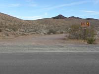 87-nondescript_sign_for_dirt_road_from_Northshore_Drive_prior_to_about_mile_marker_30
