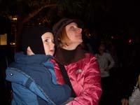 16-Kenny_and_Mommy_watching_the_snow_fall_at_Town_Square