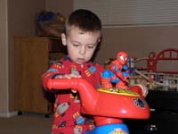 41-Kenny_looking_over_his_new_big_wheel