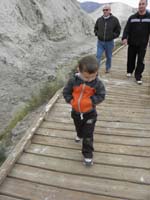 32-Kenny_using_his_coat_pockets_to_keep_his_hands_warm