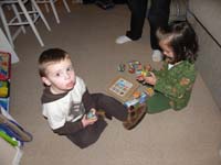 12-Kenny_and_Sierra_playing_with_a_puzzle