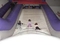 40-the_Mommies_watch_Kenny_Lily_Beeja_go_down_the_slide