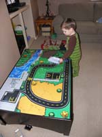 02-street_cleaner_Kenny-dusting_the_train_table