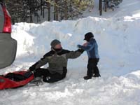 39-Daddy's_blowing_up_the_tube_and_clearing_snow_from_Kenny_after_Daddy_threw_snow_in_his_face
