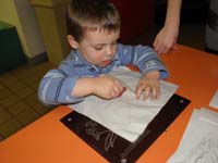 02-Kenny_coloring_a_dinosaur