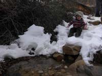 25-Kenny_throwing_snow_in_the_water