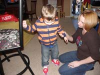 17-Mommy_helping_Kenny_rollerskate_for_the_first_time