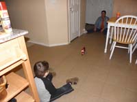 06-Kenny_and_Baba_play_with_Kenny's_new_motorcycle