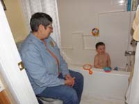 13-Kenny_tosses_water_in_the_air