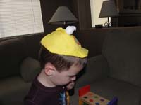02-it_no_longer_fits_his_head,but_he_still_likes_it