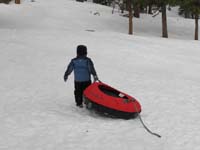 50-Kenny_carries_the_tube_up_hill-thanks_for_the_help_kid