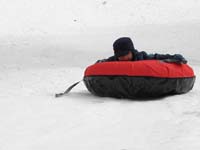 62-sequence_photos_of_Kenny_tubing_down_the_hill