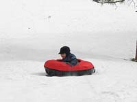 66-sequence_photos_of_Kenny_tubing_down_the_hill
